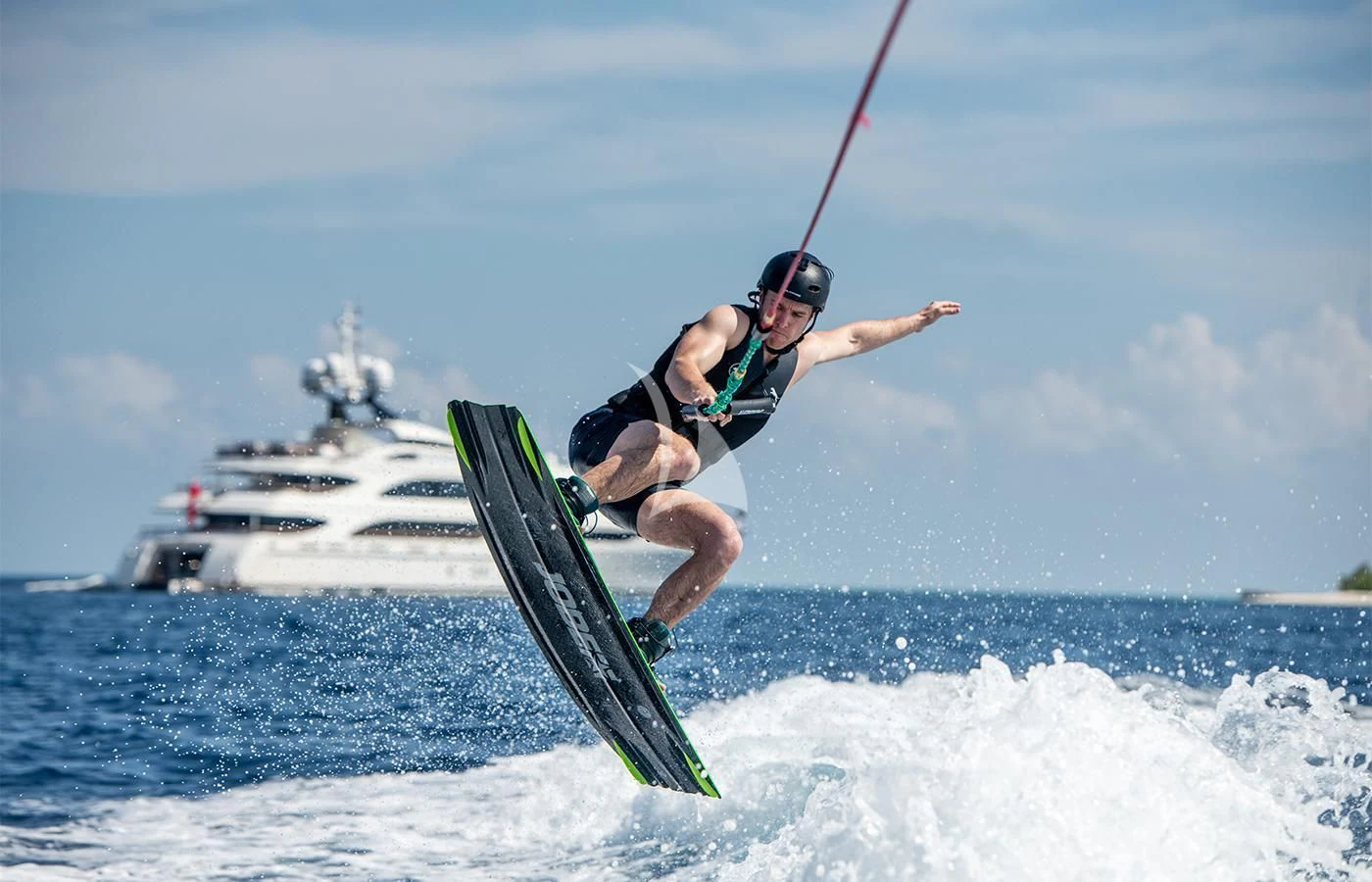 a man parasailing on a surfboard aboard JAGUAR Yacht for Charter