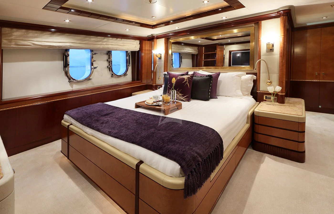 a large bed in a room aboard JAGUAR Yacht for Charter