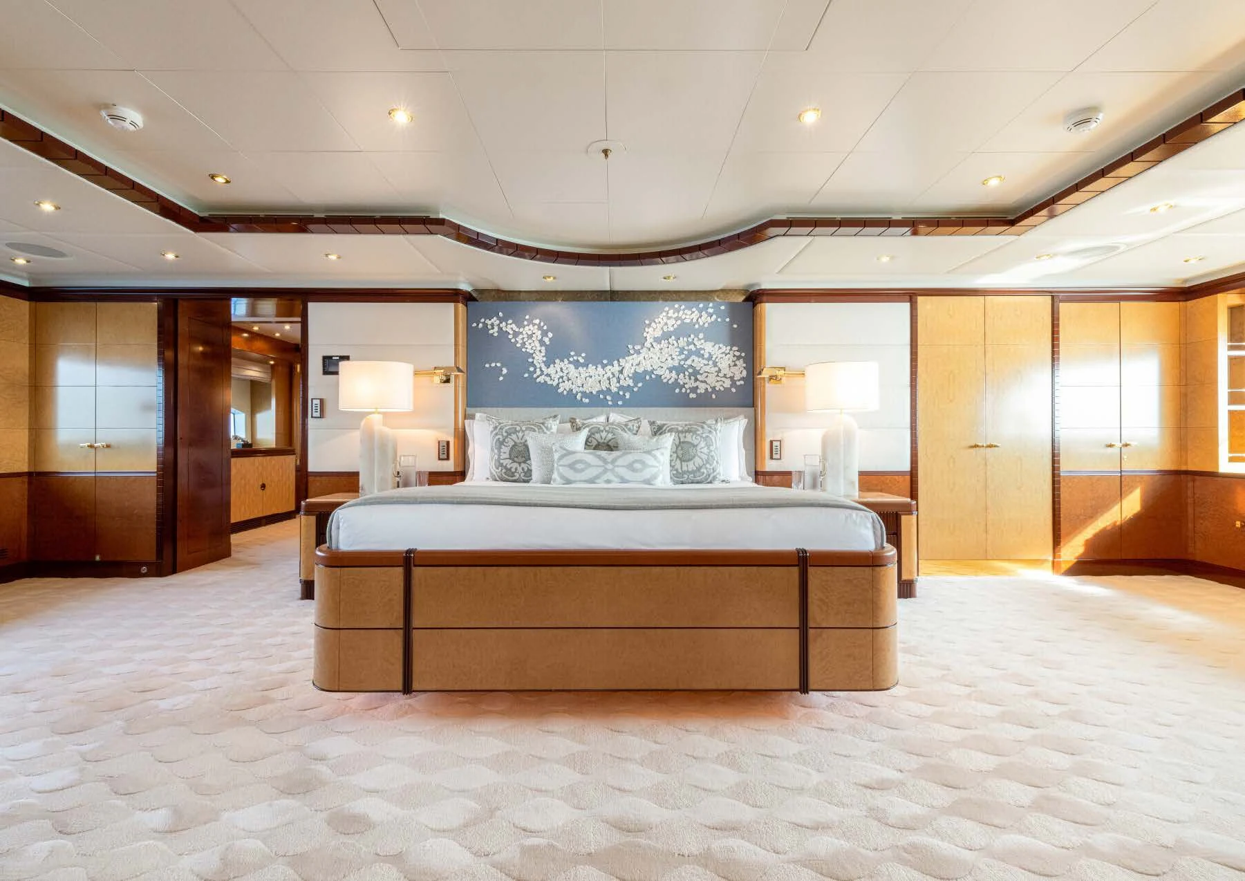 a large bedroom with a large bed aboard JAGUAR Yacht for Charter
