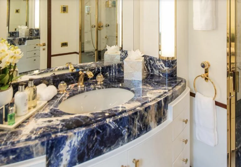 a bathroom with a sink and mirror aboard JAGUAR Yacht for Charter