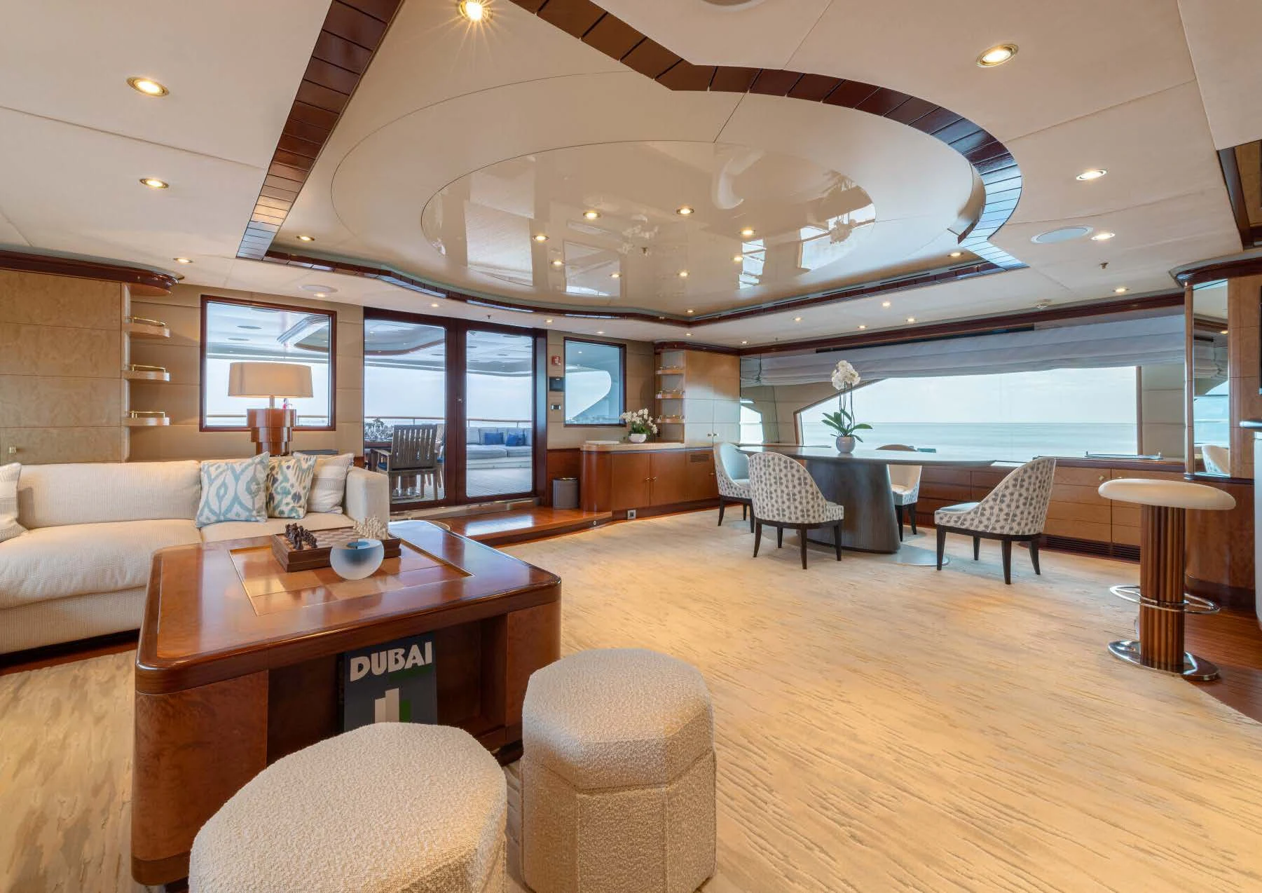 a large living room with a large glass ceiling aboard JAGUAR Yacht for Charter