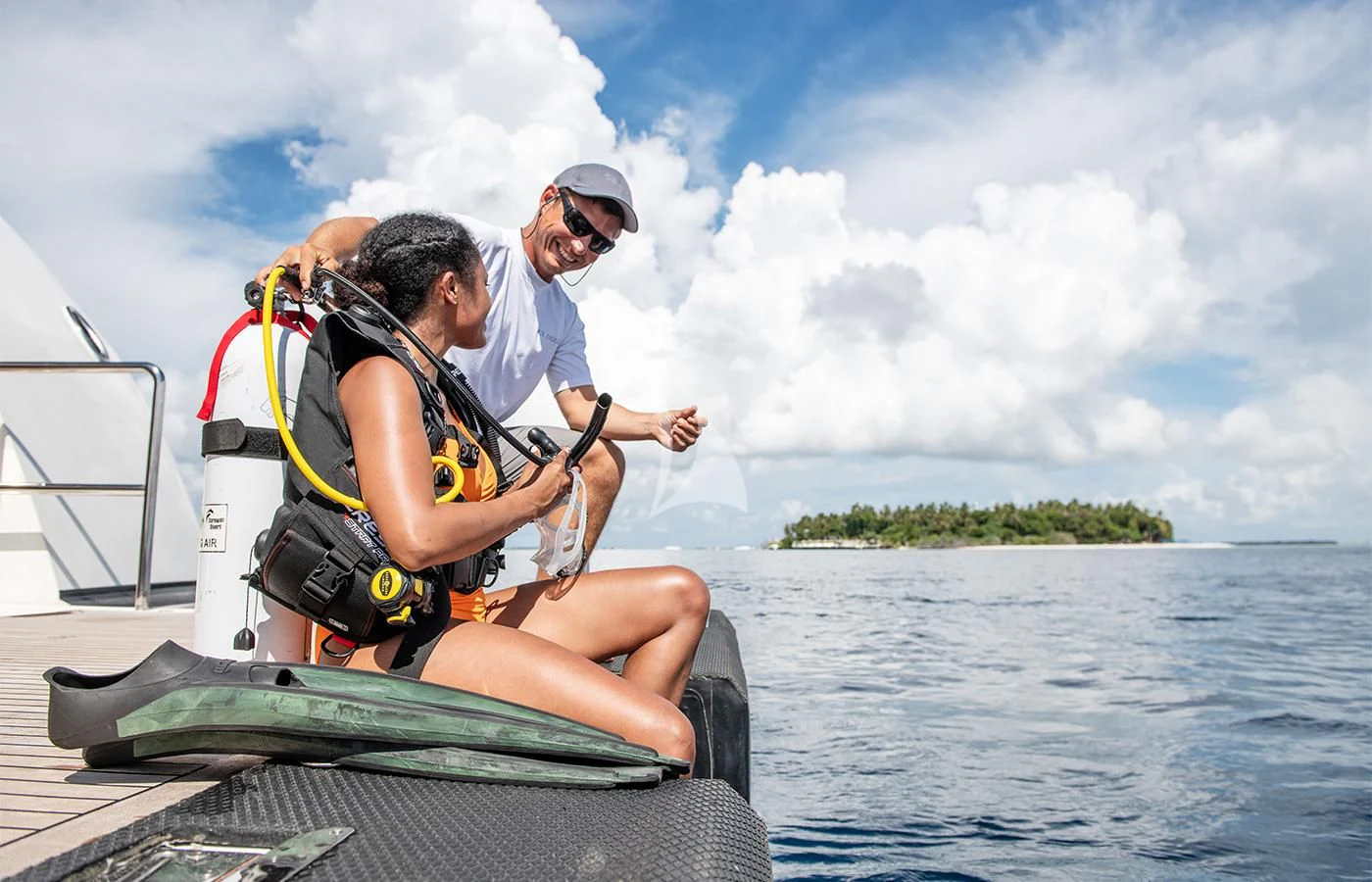 a man and a woman on a boat aboard JAGUAR Yacht for Charter