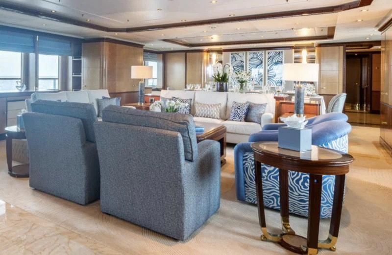 a living room with a couch and a coffee table aboard JAGUAR Yacht for Charter