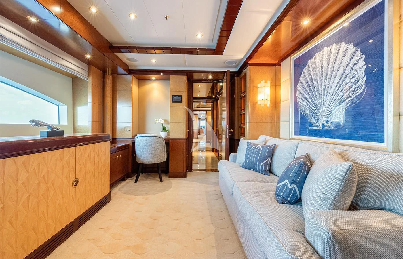 a room with a couch and a chair and a window aboard JAGUAR Yacht for Charter