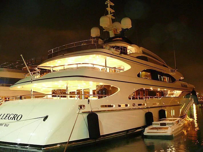 a large white boat with a large white boat on it aboard JAGUAR Yacht for Charter