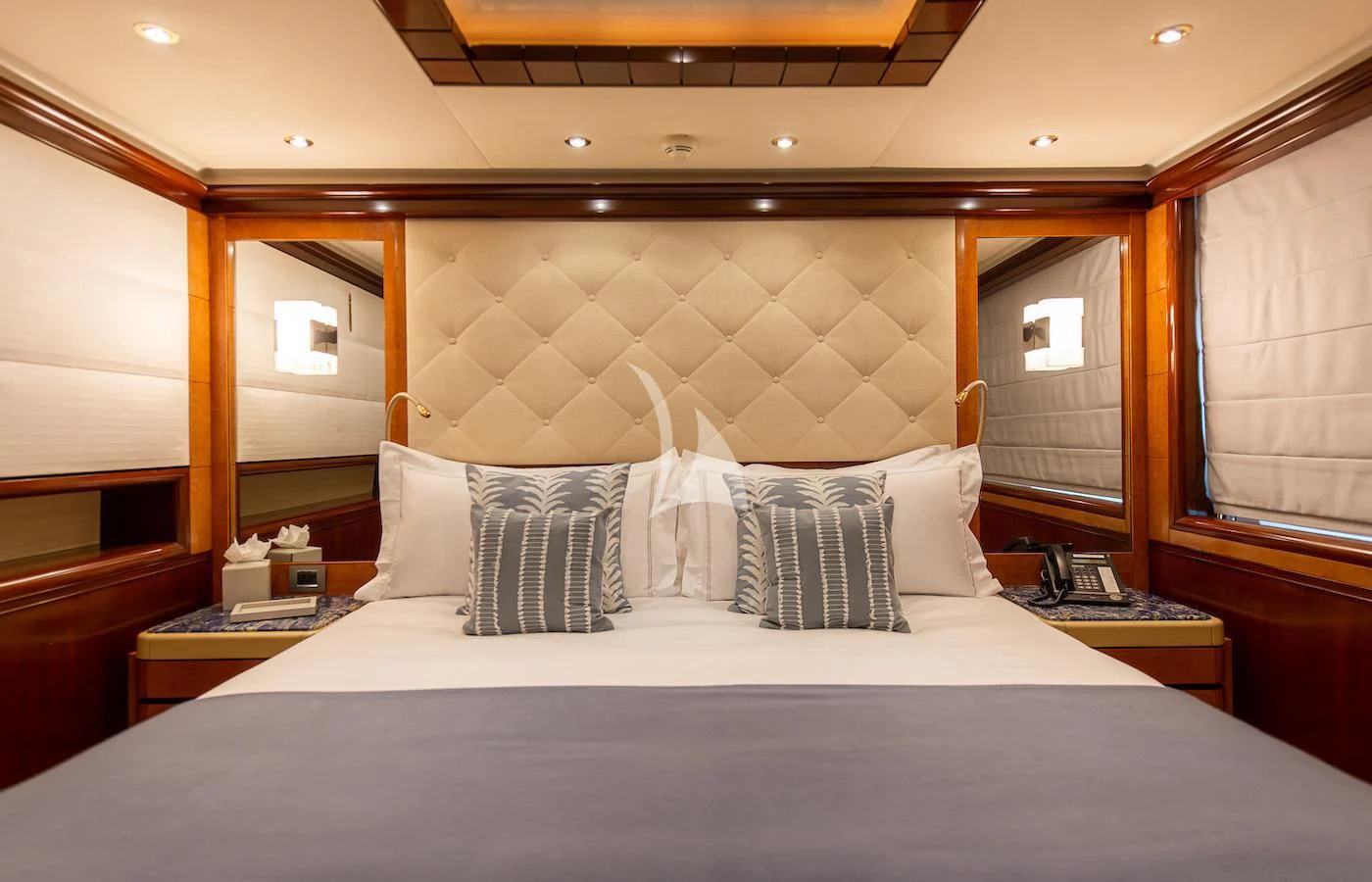 a bed with white sheets aboard JAGUAR Yacht for Charter