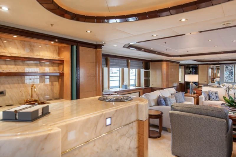 a living room with a large wood wall aboard JAGUAR Yacht for Charter