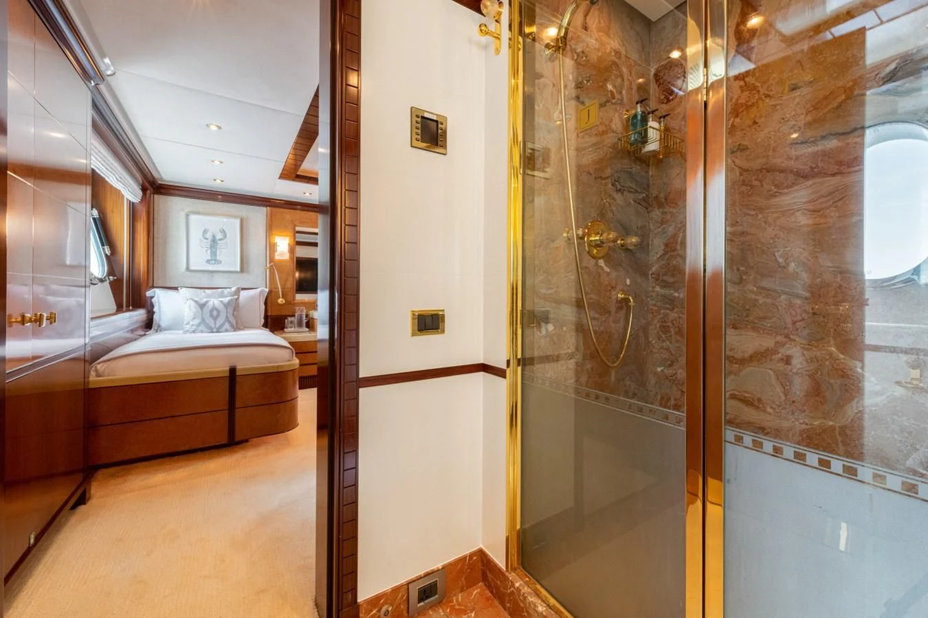 a room with a bed and a glass door aboard JAGUAR Yacht for Charter