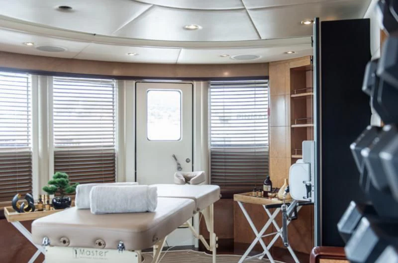 a living room with a couch and a table aboard JAGUAR Yacht for Charter