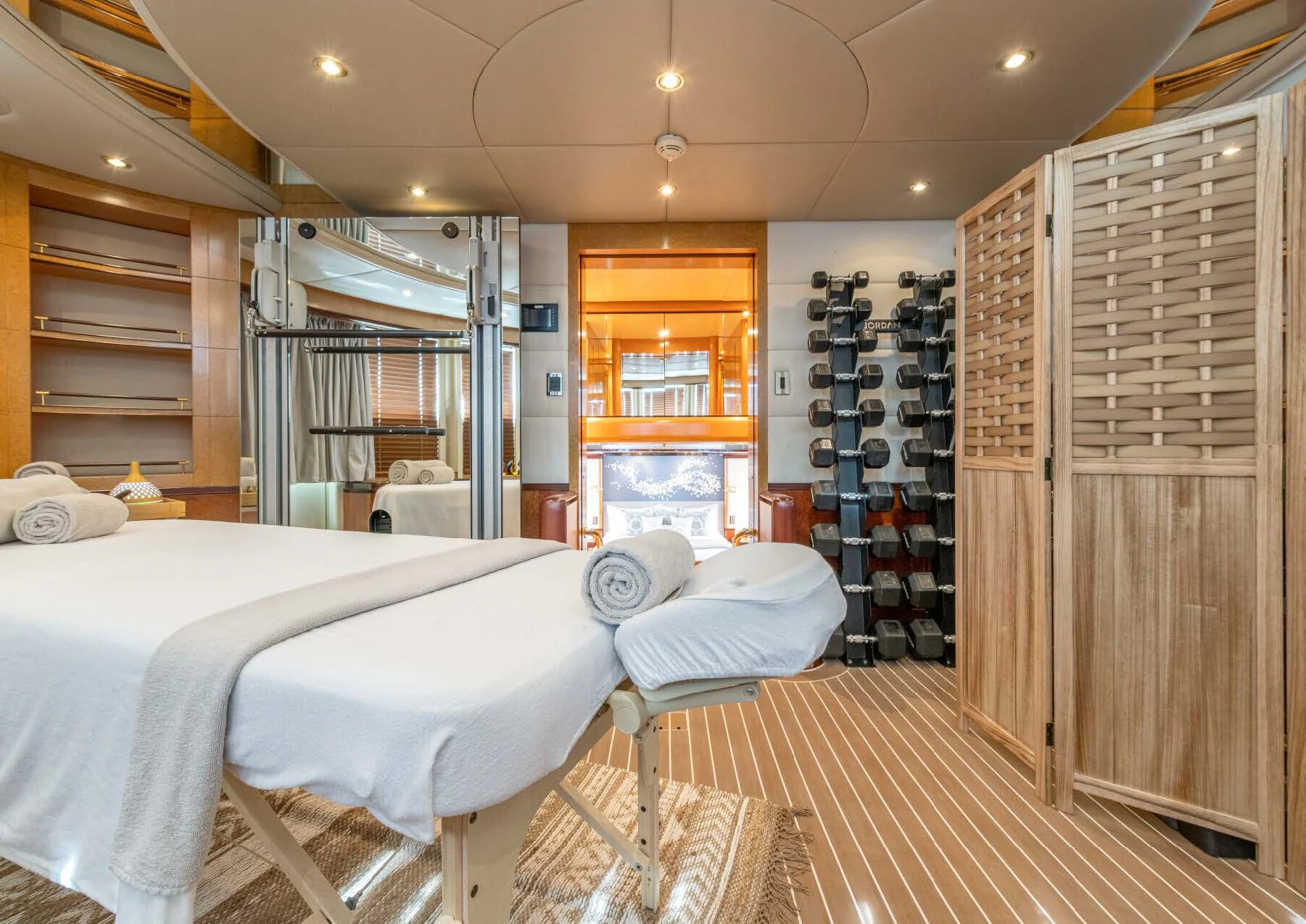 a room with a bed and a closet aboard JAGUAR Yacht for Charter
