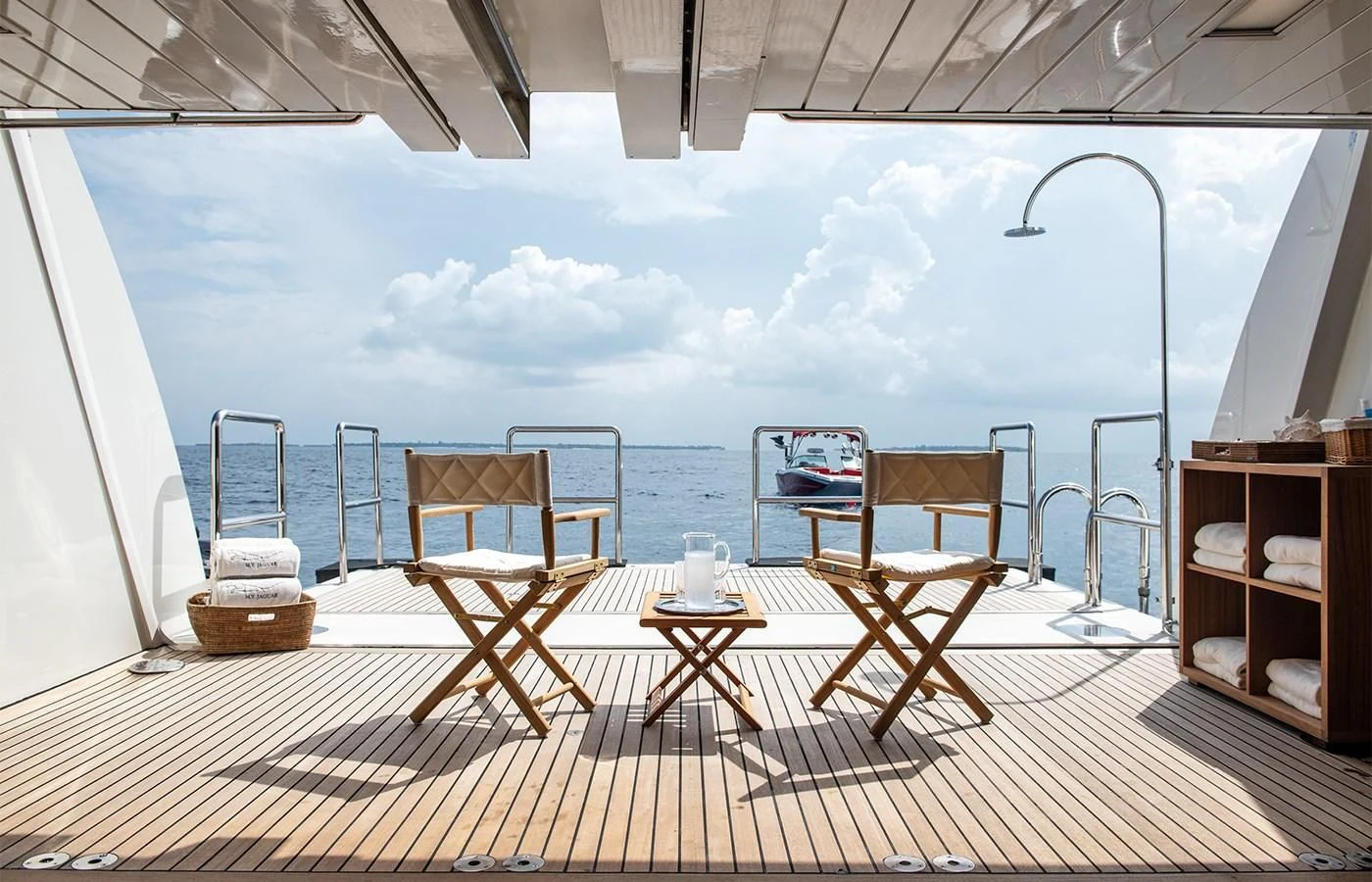 a room with a table and chairs on a deck aboard JAGUAR Yacht for Charter