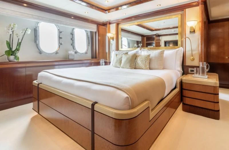 a large bed in a room aboard JAGUAR Yacht for Charter