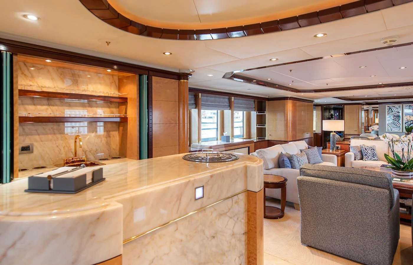 a living room with a couch and a table aboard JAGUAR Yacht for Charter