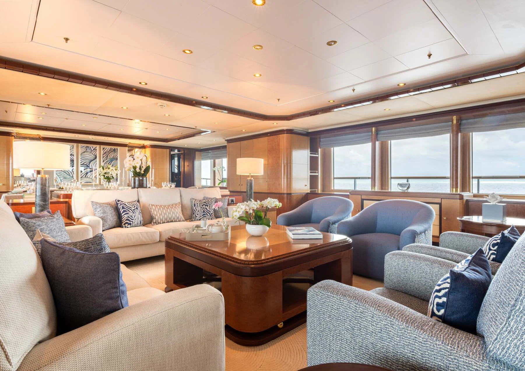 a living room with a table and couches aboard JAGUAR Yacht for Charter