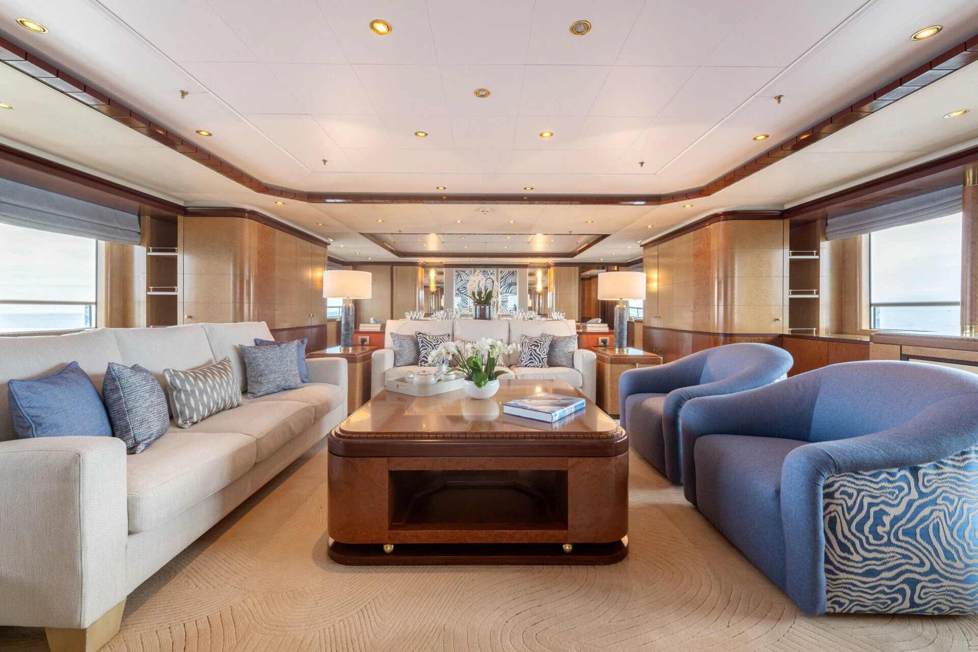 a living room with a couch and a coffee table aboard JAGUAR Yacht for Charter