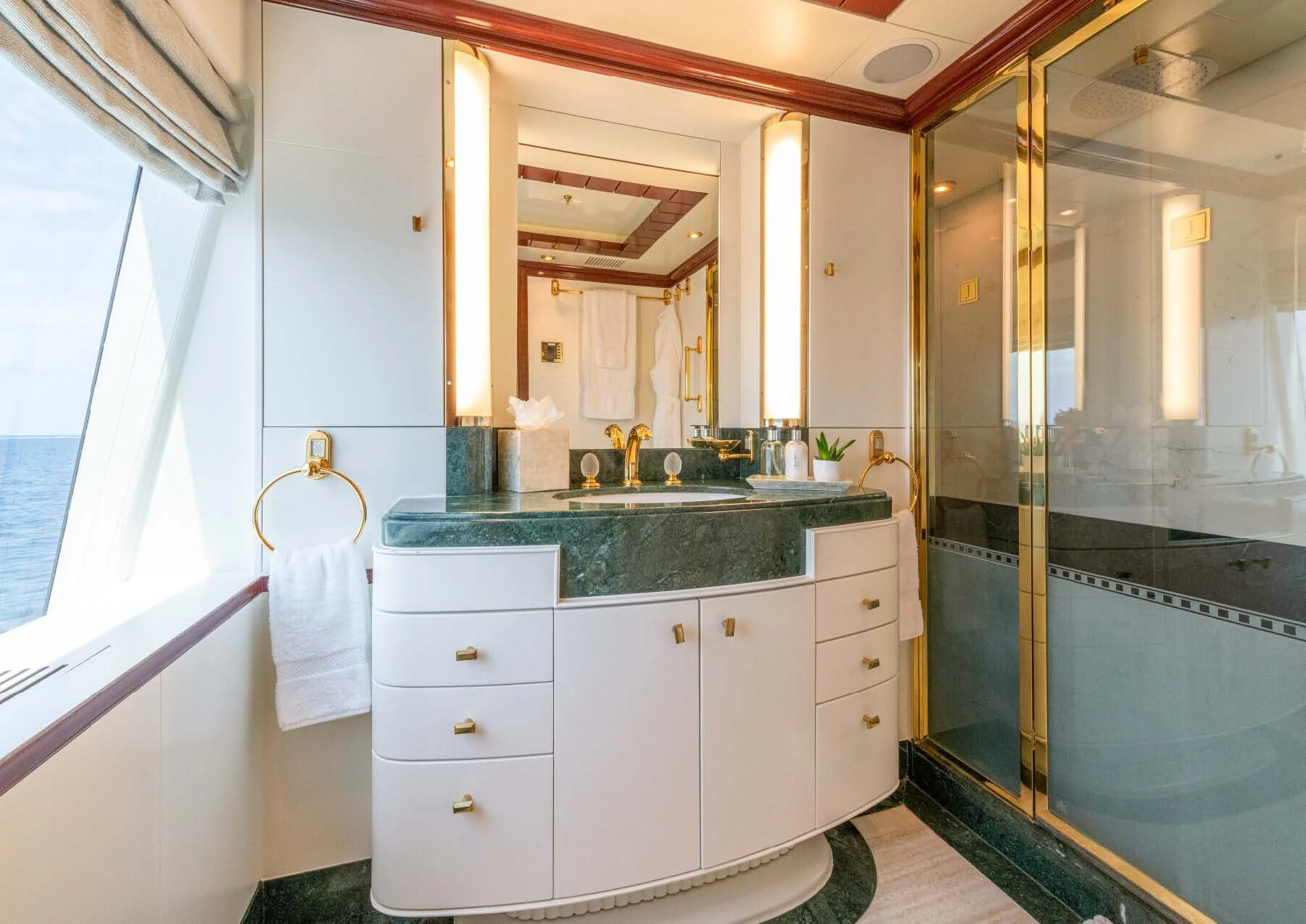 a bathroom with a sink and a shower aboard JAGUAR Yacht for Charter