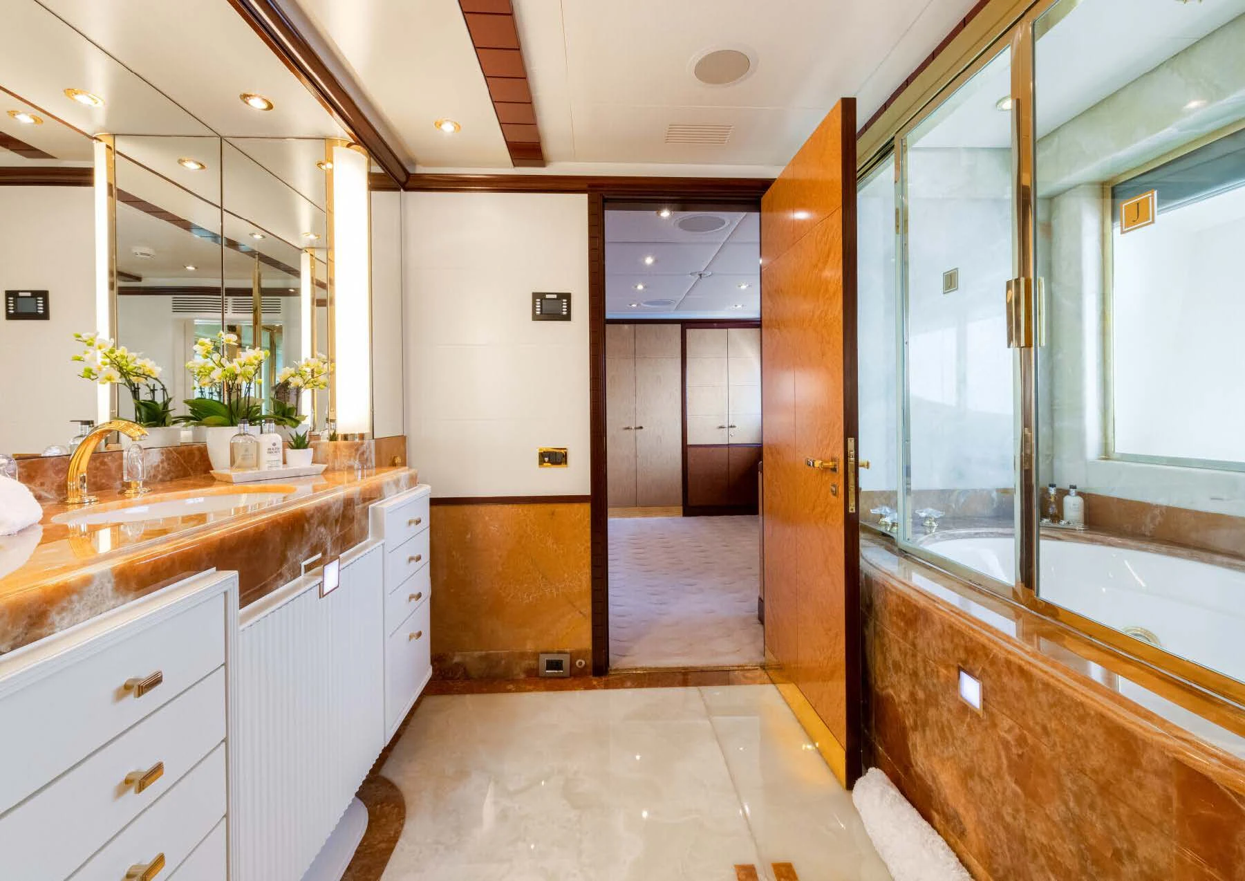 a bathroom with a large mirror aboard JAGUAR Yacht for Charter