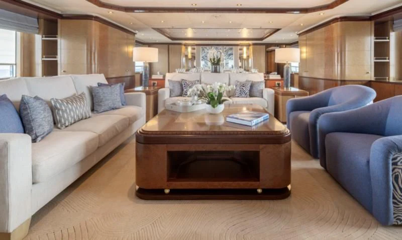 a living room with a couch and a coffee table aboard JAGUAR Yacht for Charter