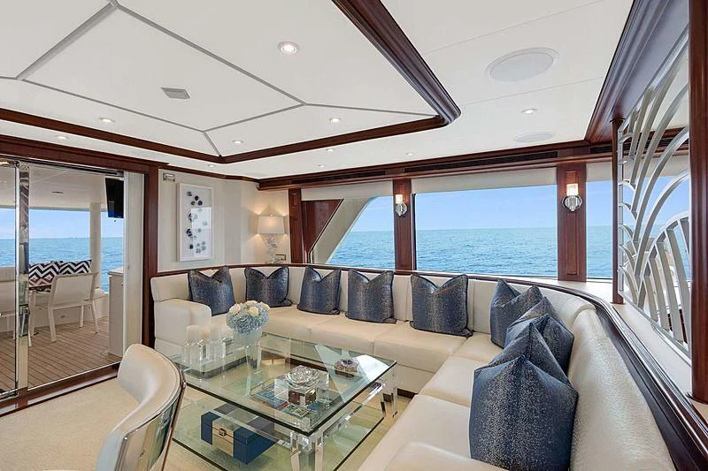 a living room with a large balcony aboard LEMONADE Yacht for Sale