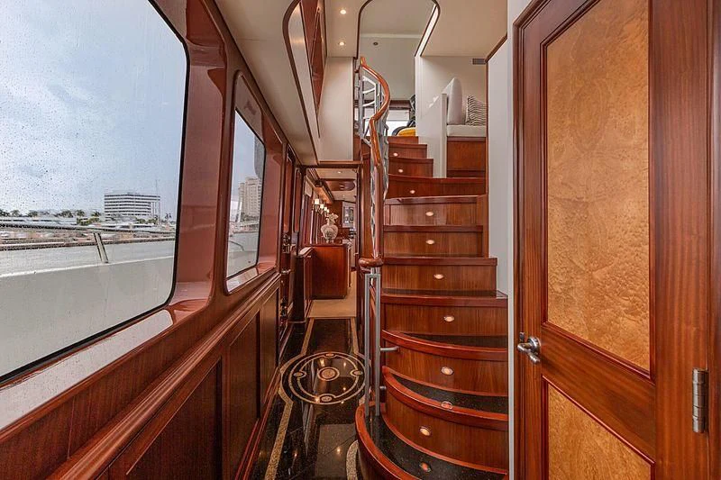 a wooden staircase with a glass door aboard LEMONADE Yacht for Sale