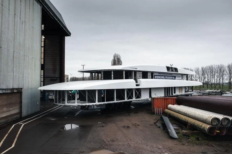 a bus parked outside a building aboard DRIZZLE Yacht for Sale