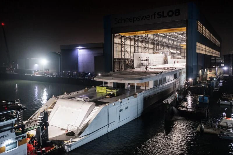 a large boat docked at a pier aboard DRIZZLE Yacht for Sale