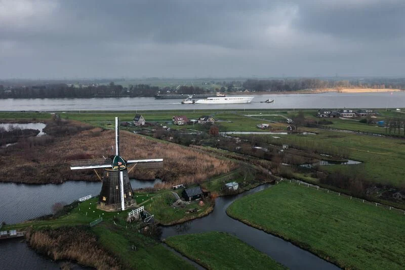 a windmill on a grassy field aboard DRIZZLE Yacht for Sale