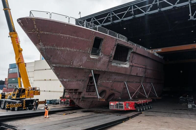 a large red and white crane aboard DRIZZLE Yacht for Sale