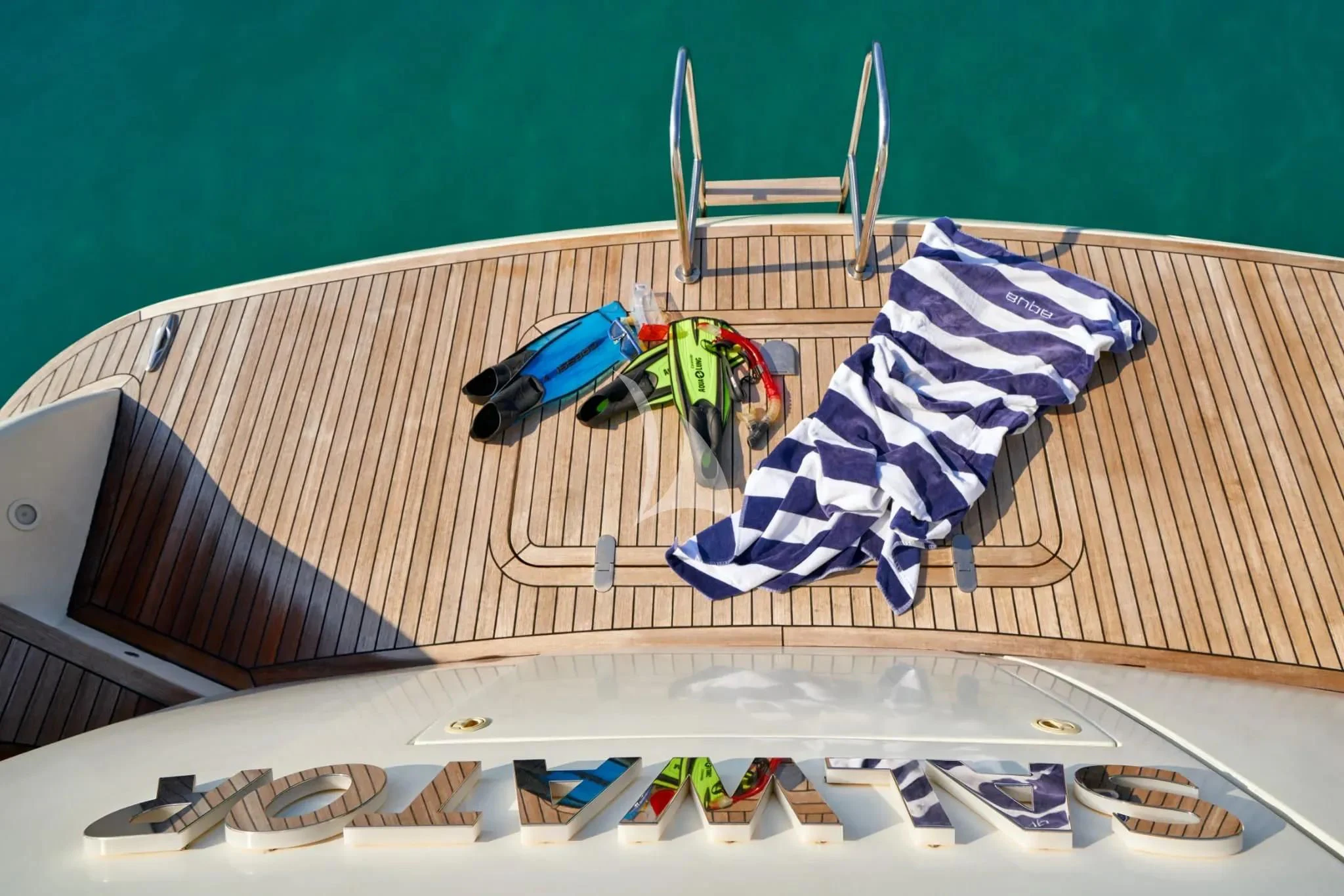 a table with a chair and a table with a cloth on it aboard W Yacht for Sale
