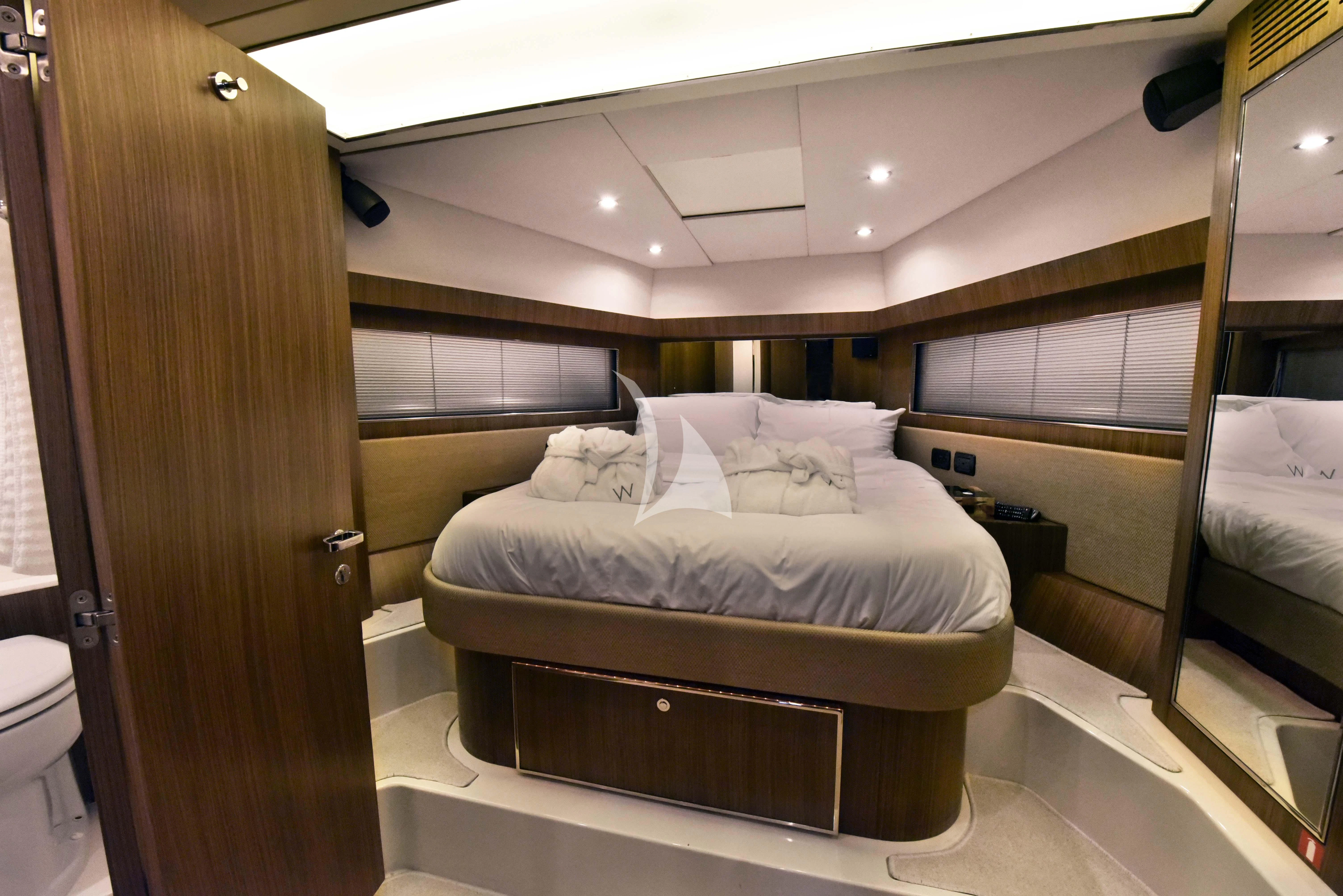 a room with a bed and a mirror aboard W Yacht for Sale