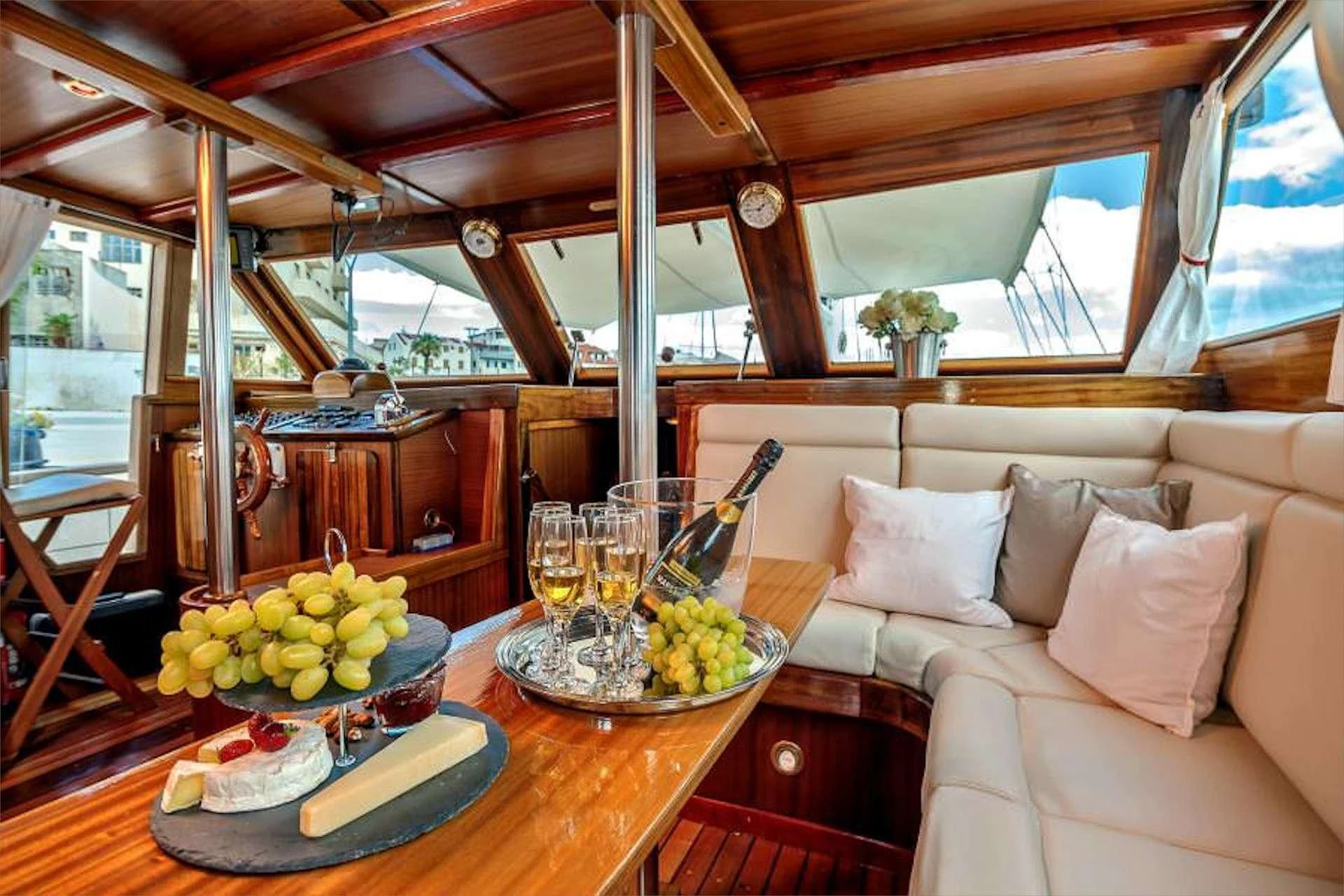 a table with food and glasses on it aboard W Yacht for Sale