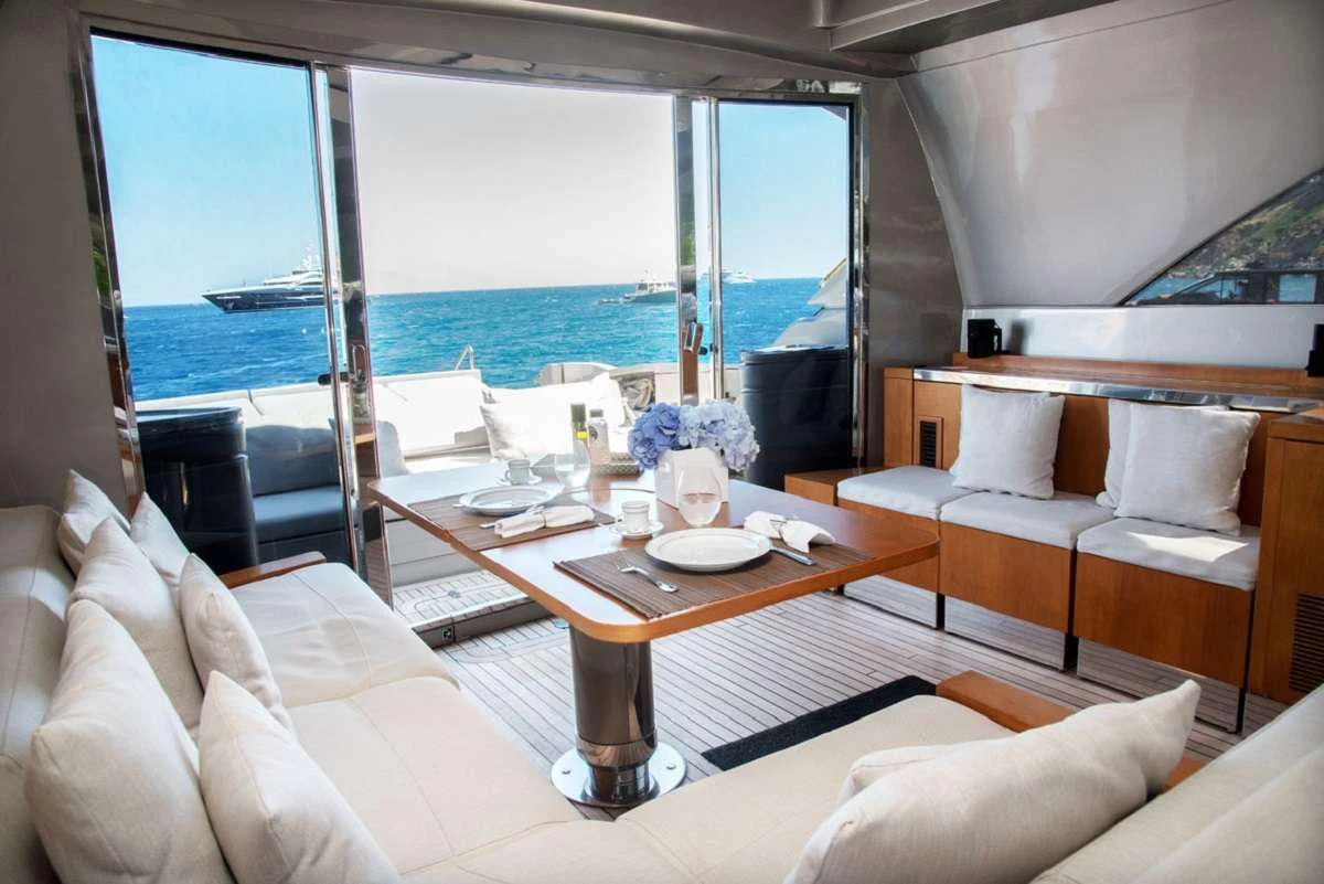 a room with a table and chairs aboard W Yacht for Sale