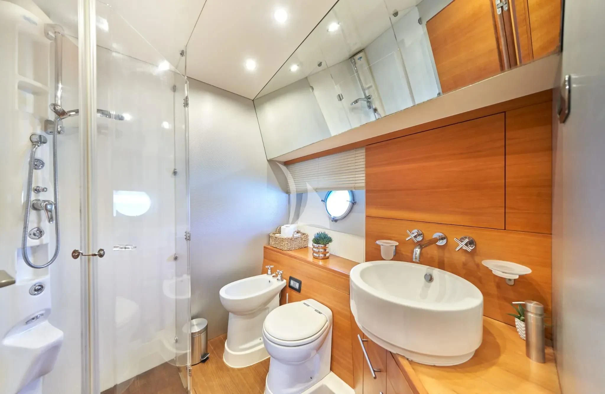 a bathroom with a sink toilet and shower aboard W Yacht for Sale