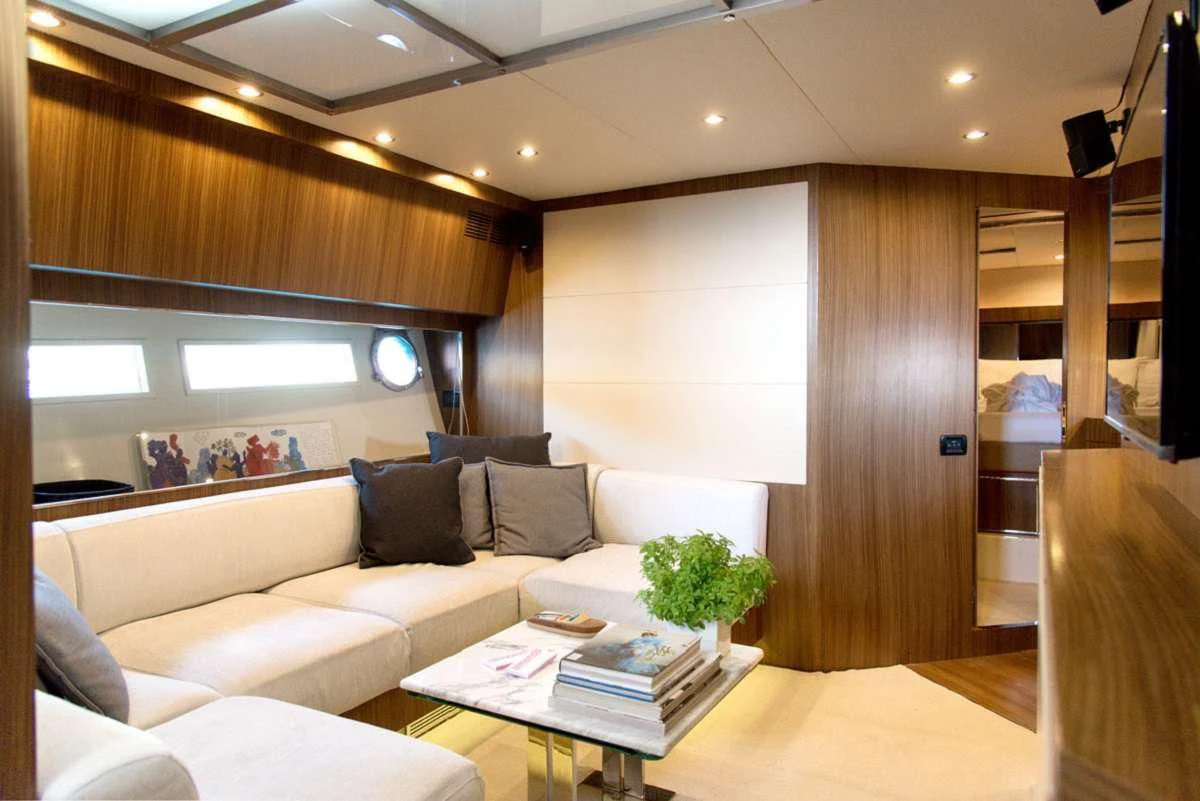 a living room with a couch and a coffee table aboard W Yacht for Sale