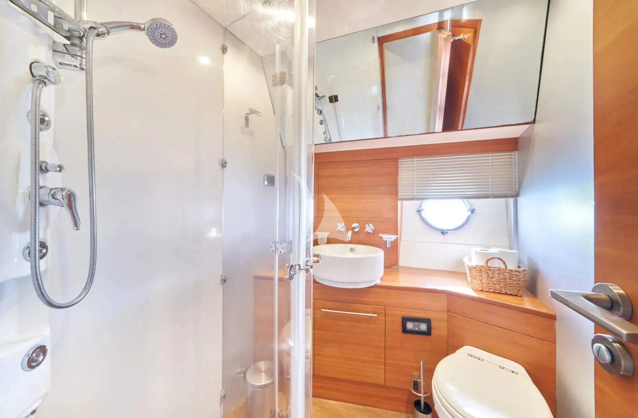 a bathroom with a shower sink and toilet aboard W Yacht for Sale