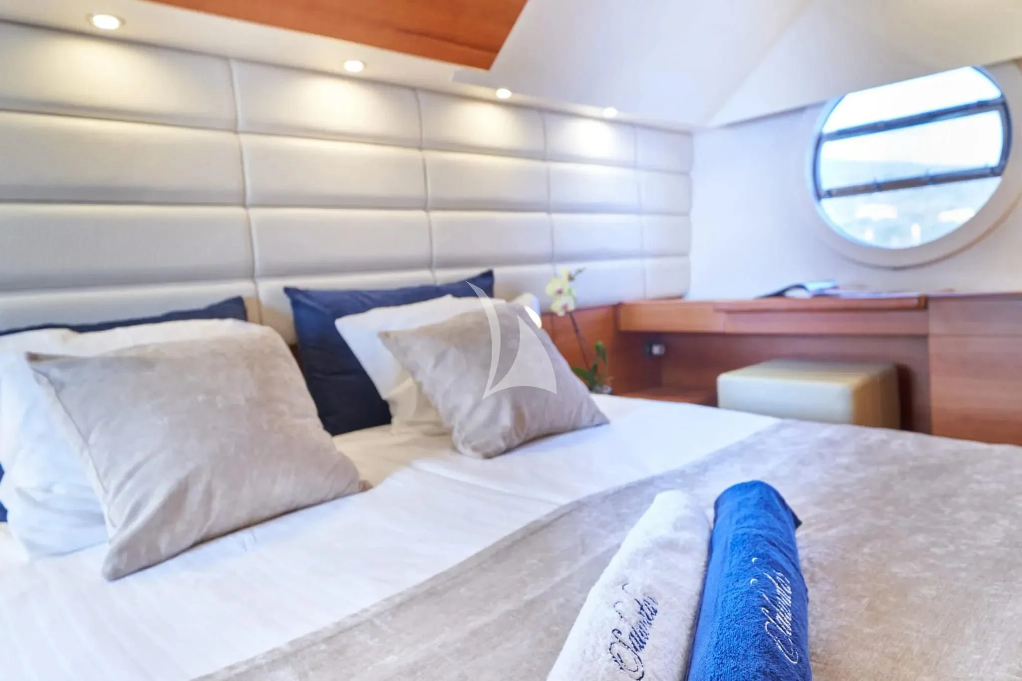 a bed with white sheets and pillows aboard W Yacht for Sale