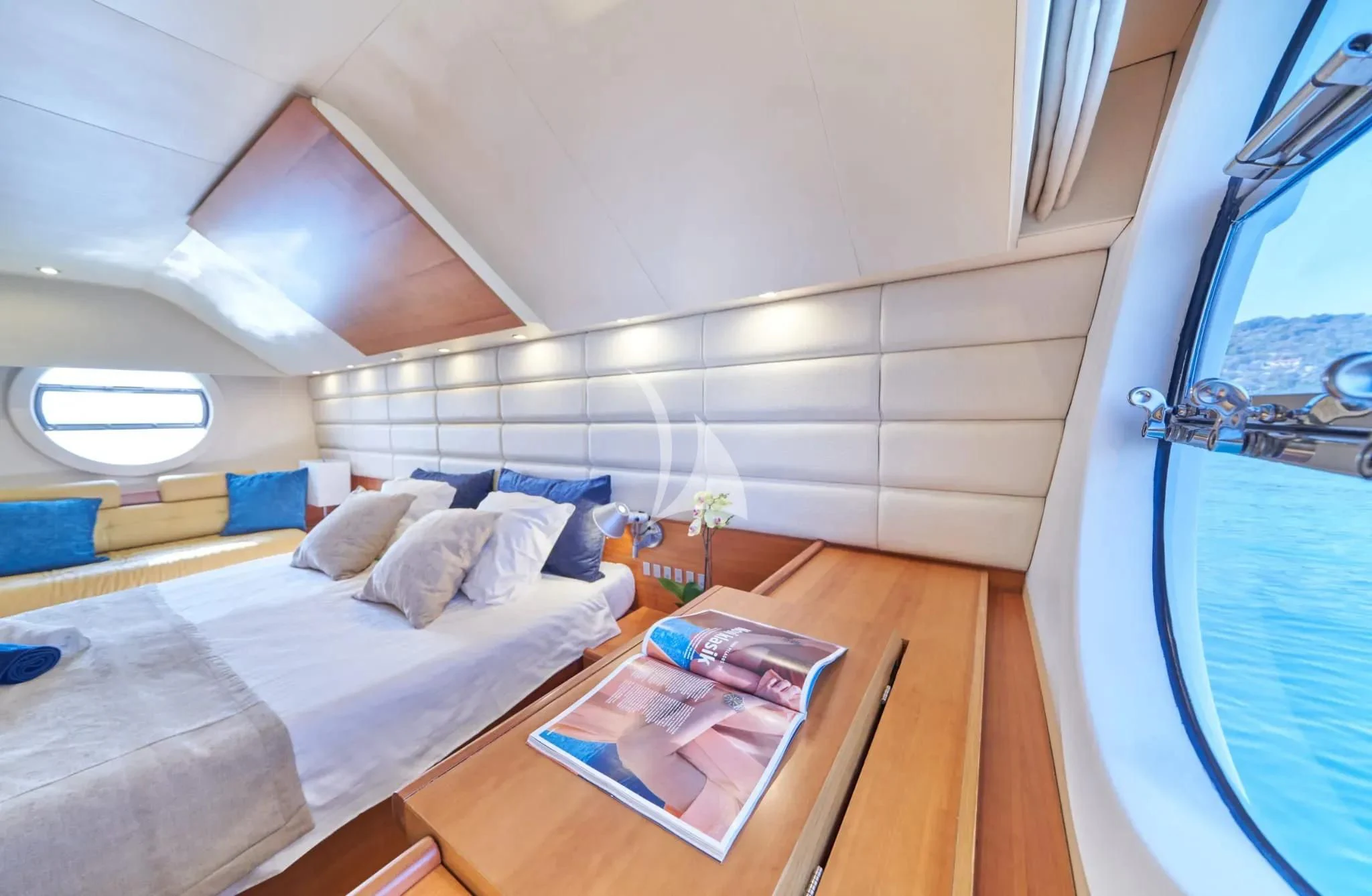 a room with a bed and a table aboard W Yacht for Sale