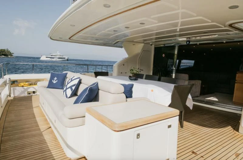 a room with a bed and a large boat in the background aboard CEYLANIM Yacht for Sale