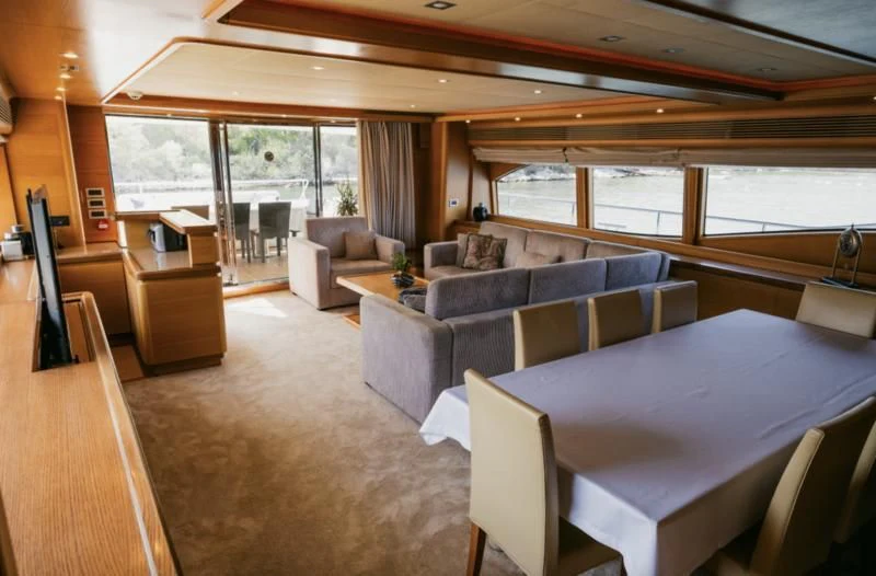 a living room with a couch and a table aboard CEYLANIM Yacht for Sale