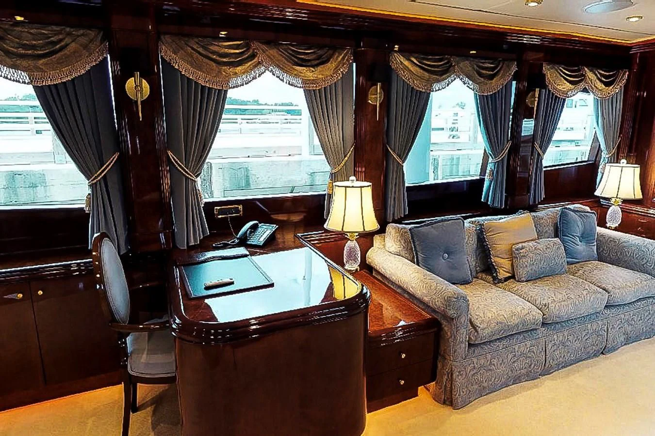 a living room with a couch and a table aboard IDLETYME II Yacht for Sale
