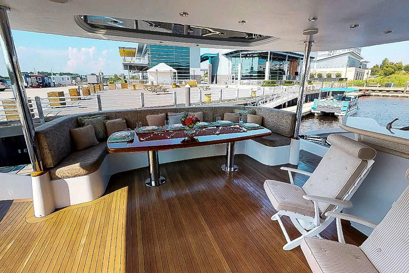 a living room with a couch and a pool aboard IDLETYME II Yacht for Sale