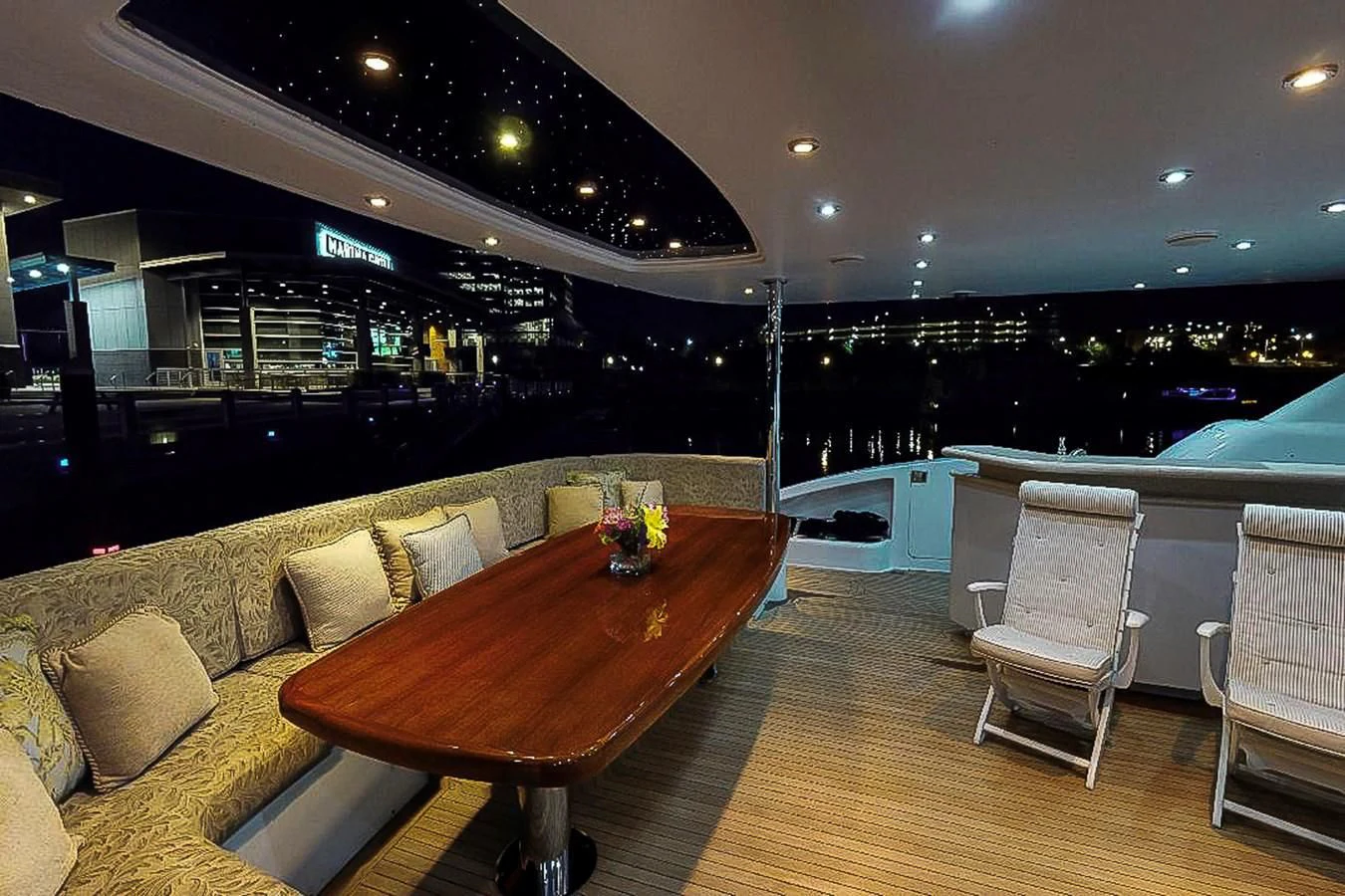 a table and chairs in a room aboard IDLETYME II Yacht for Sale
