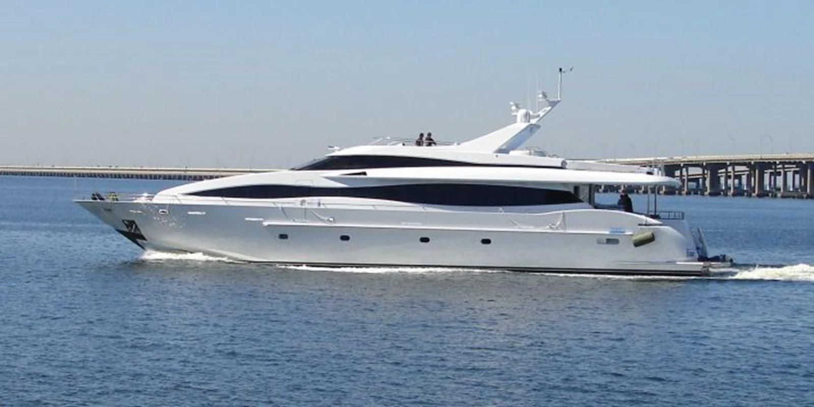 a white yacht in the water aboard IDLETYME II Yacht for Sale