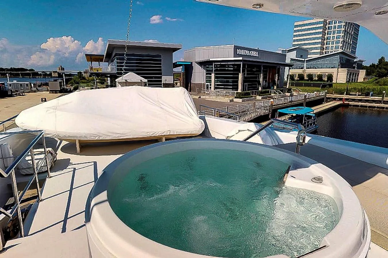 a pool with a building in the background aboard IDLETYME II Yacht for Sale