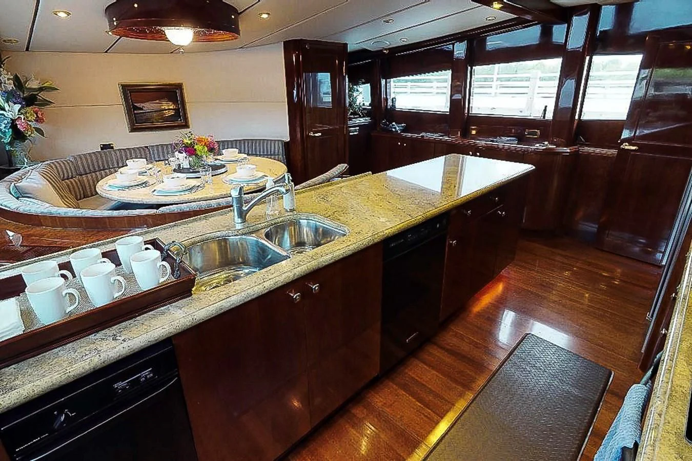 a kitchen with a large island aboard IDLETYME II Yacht for Sale