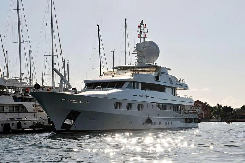 a large white boat in the water aboard TALES Yacht for Sale