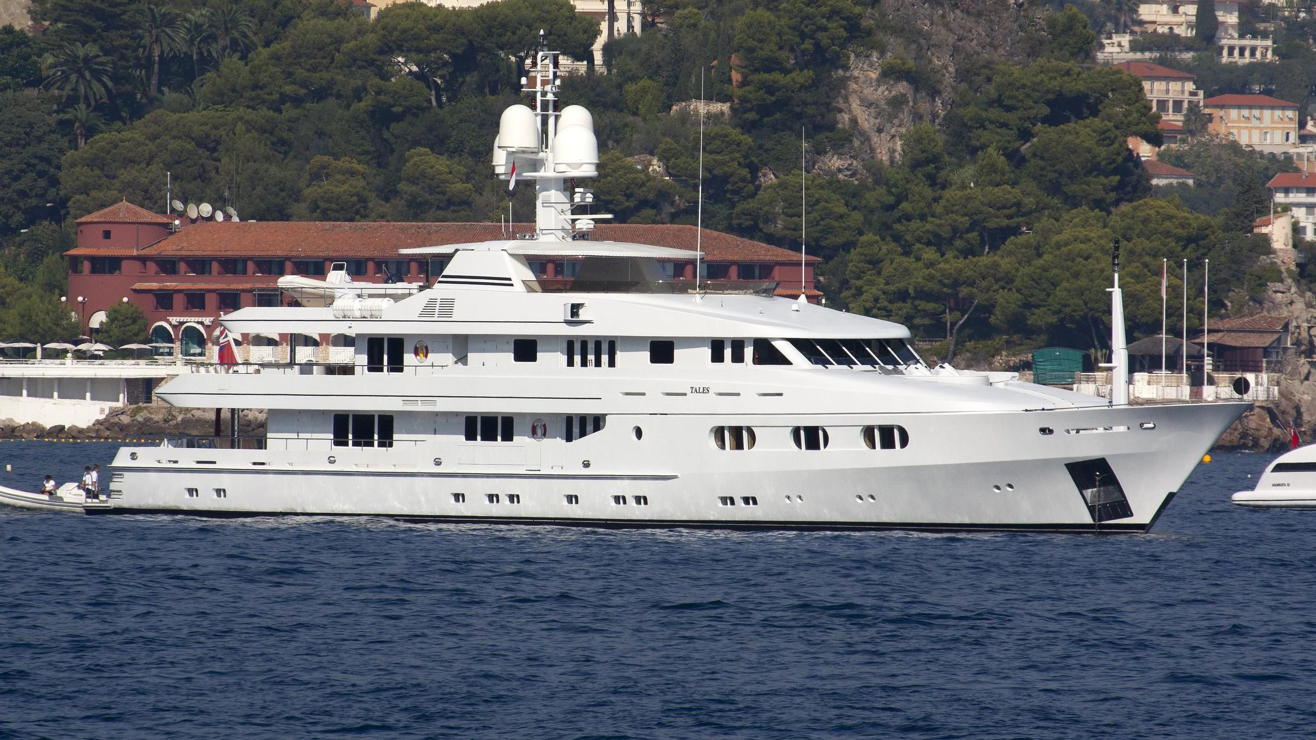a large white boat in the water aboard TALES Yacht for Sale