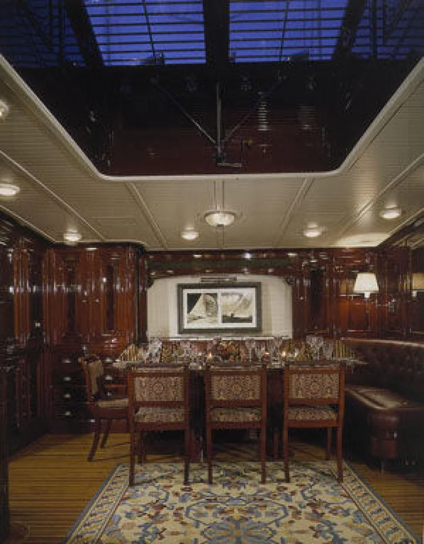 a room with a table and chairs aboard RANGER Yacht for Sale