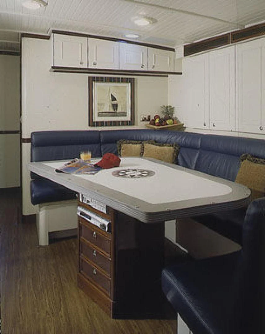 a kitchen with a blue couch aboard RANGER Yacht for Sale