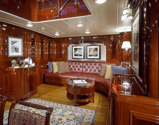 a living room with a wood paneled wall aboard RANGER Yacht for Sale